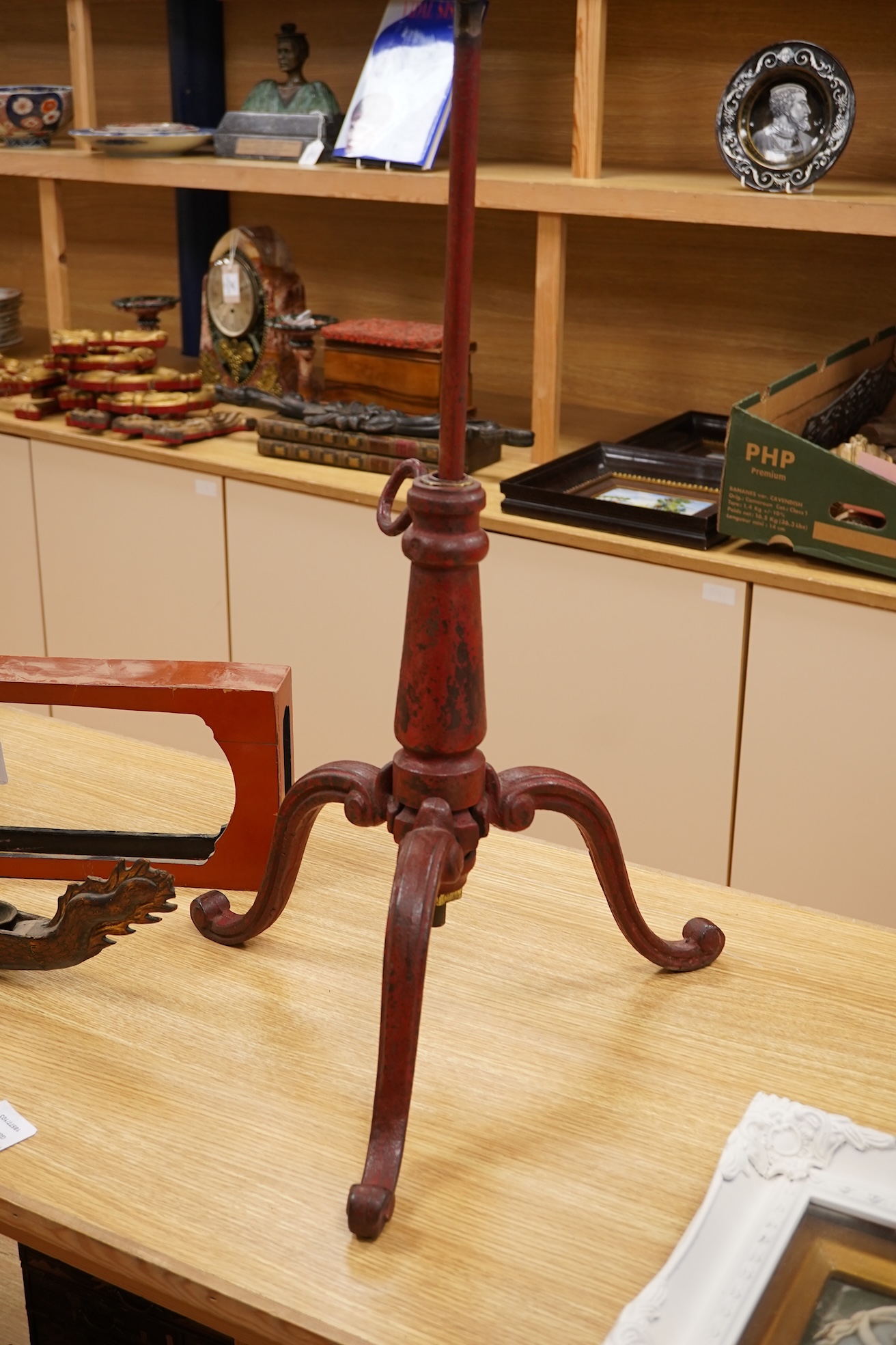 A 19th century red japanned (heavy) cast iron telescopic tripod base, 63cm minimum